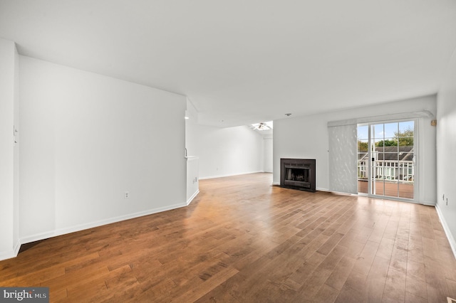 unfurnished living room featuring hardwood / wood-style floors