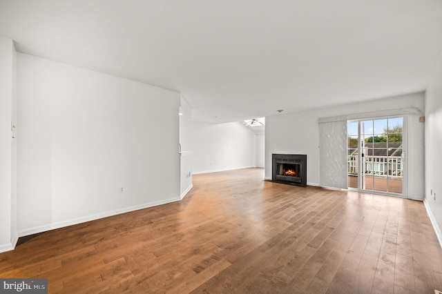 unfurnished living room with hardwood / wood-style flooring