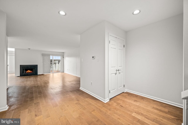 unfurnished living room featuring light hardwood / wood-style floors