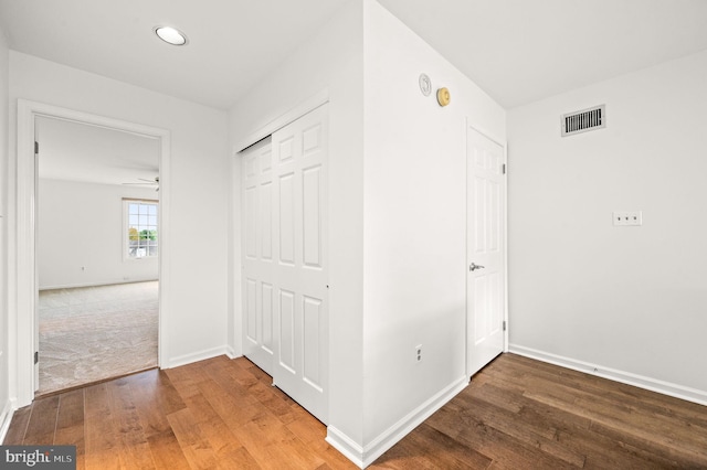 corridor featuring wood-type flooring