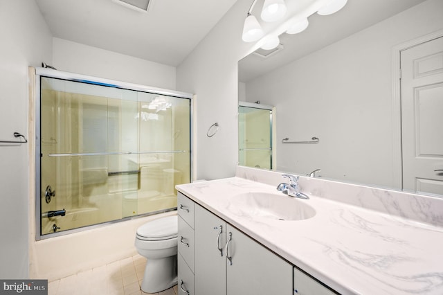 full bathroom with enclosed tub / shower combo, vanity, and toilet