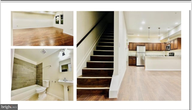 staircase featuring wood-type flooring and sink