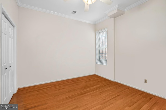 unfurnished room with ceiling fan, crown molding, and light hardwood / wood-style flooring