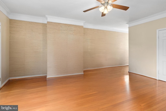 unfurnished room with ceiling fan, hardwood / wood-style floors, and ornamental molding