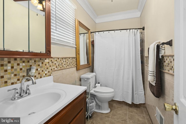 bathroom featuring tile patterned flooring, vanity, tile walls, and ornamental molding