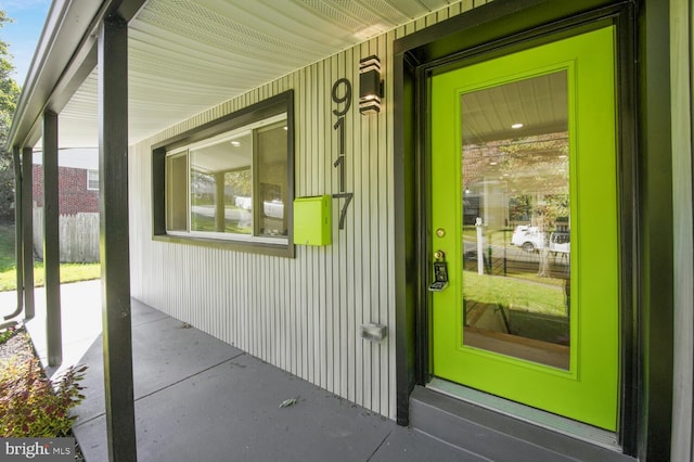 property entrance featuring covered porch