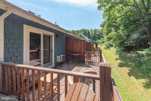 deck featuring a yard and central air condition unit