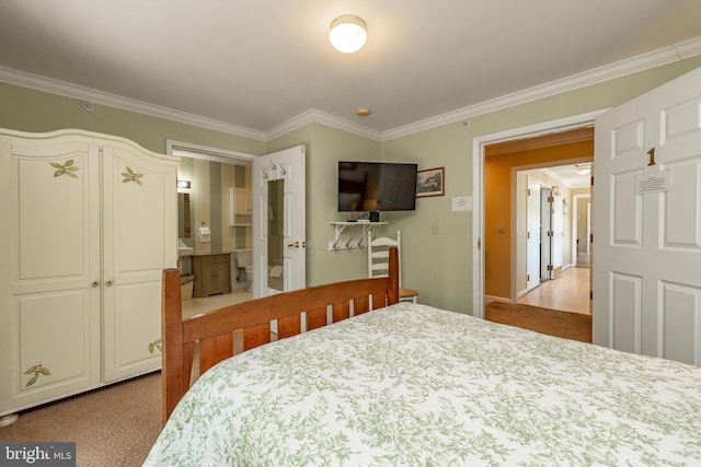 carpeted bedroom with ornamental molding