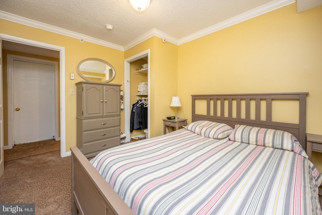 bedroom featuring a textured ceiling, carpet, ornamental molding, and a closet