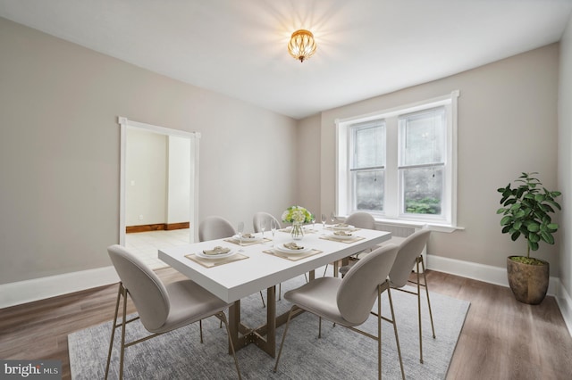 dining room with dark hardwood / wood-style floors