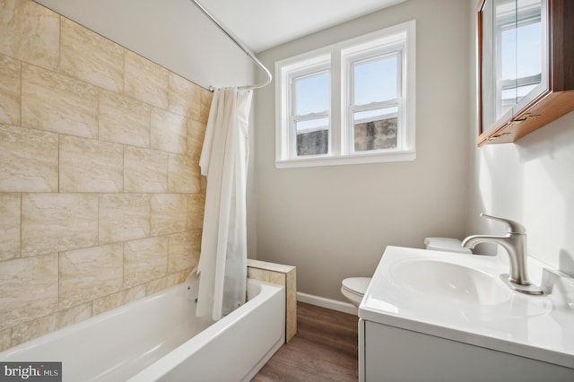 full bathroom with toilet, shower / tub combo, vanity, and wood-type flooring