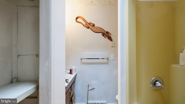 bathroom featuring vanity and toilet