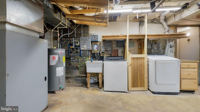 basement featuring separate washer and dryer, water heater, and heating unit