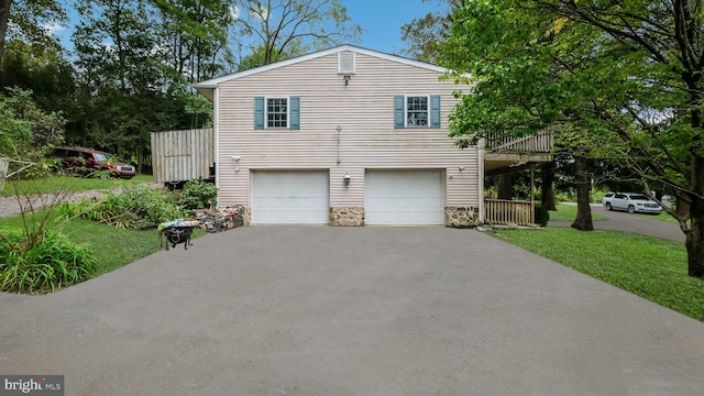 view of front of house with a garage and a front yard