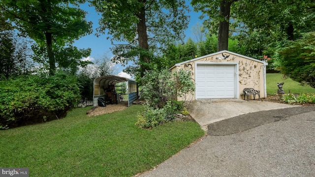 garage featuring a lawn and a carport