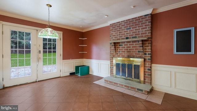 unfurnished living room featuring ornamental molding, a brick fireplace, and tile patterned flooring