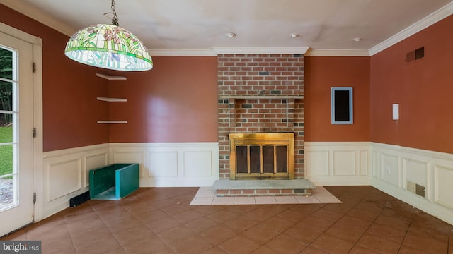 unfurnished living room with crown molding, a fireplace, and tile patterned floors