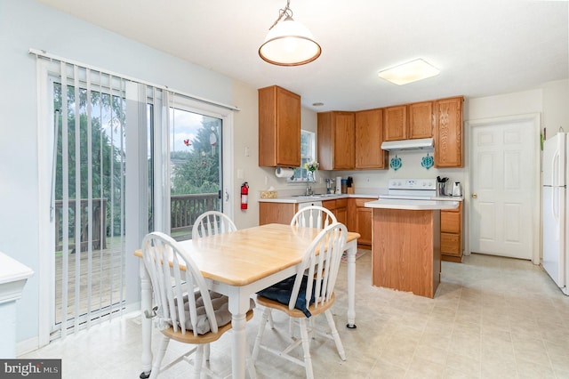 dining space featuring sink