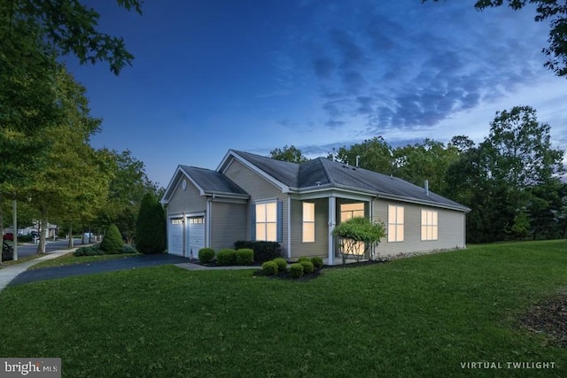 property exterior at dusk featuring a yard