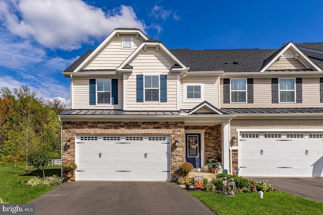 view of front of home featuring a garage and a front yard