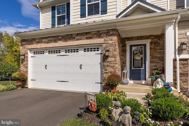 view of exterior entry with a garage