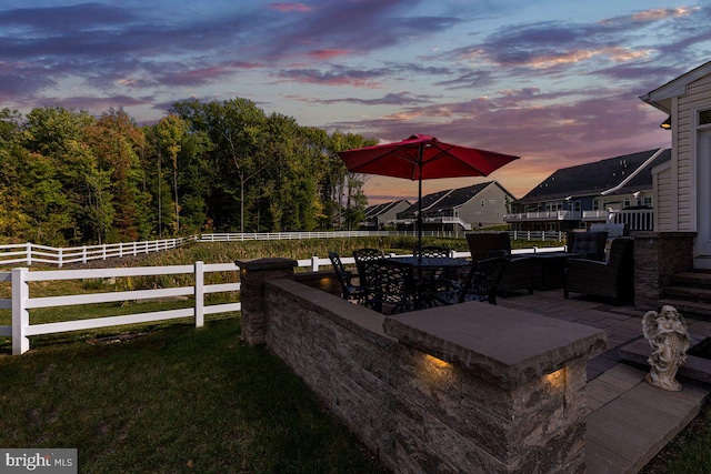 yard at dusk with a patio