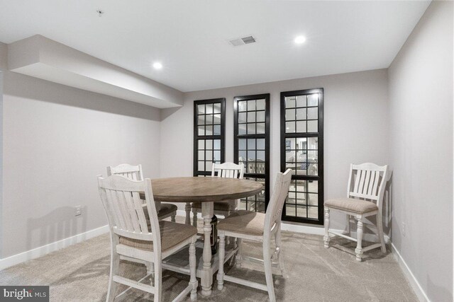 dining room with carpet floors