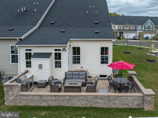 rear view of property with a patio, an outdoor living space, and a yard