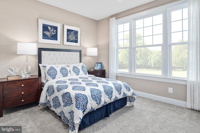 bedroom with light colored carpet