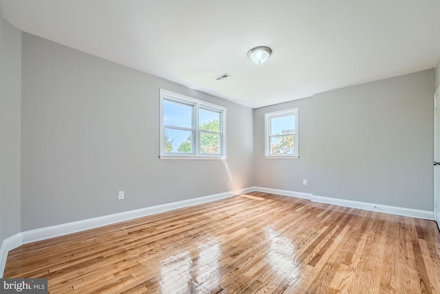 unfurnished room with light hardwood / wood-style flooring