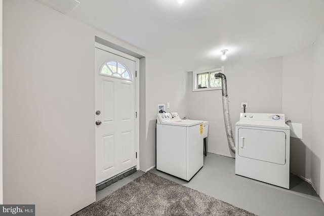 laundry area featuring washing machine and clothes dryer