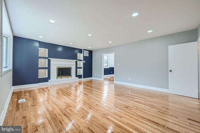 unfurnished living room featuring light wood-type flooring