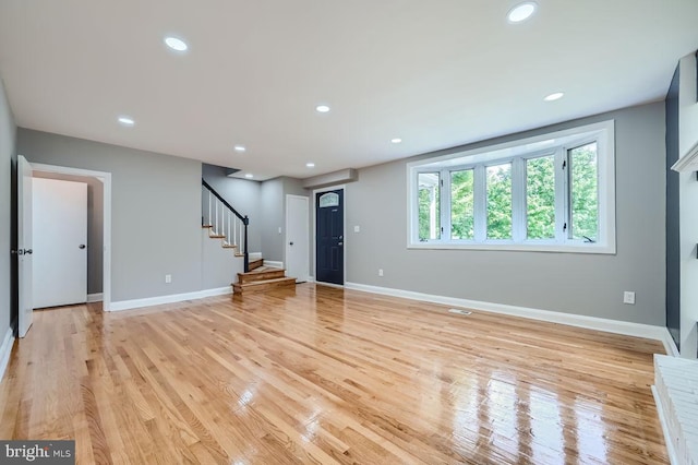 unfurnished living room with light hardwood / wood-style floors