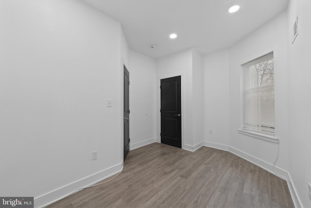 spare room with light hardwood / wood-style flooring