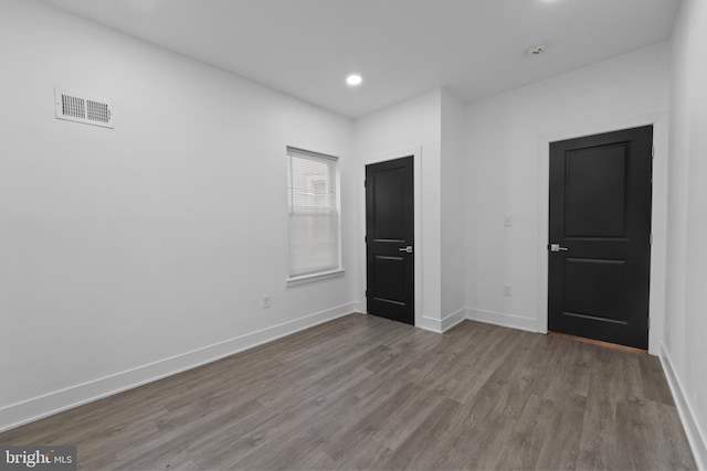 empty room featuring hardwood / wood-style floors