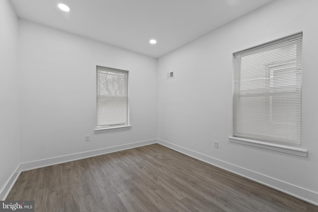 empty room with wood-type flooring