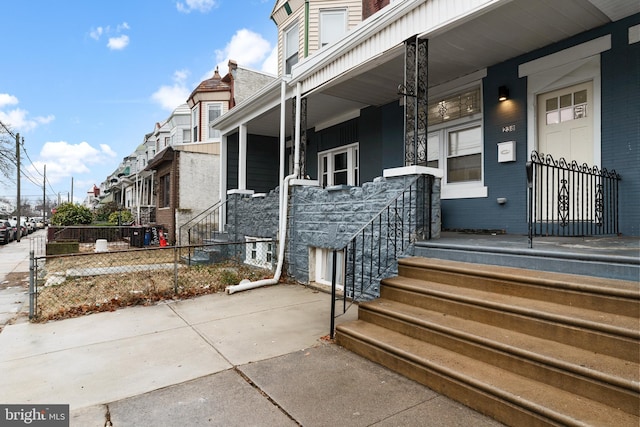 doorway to property featuring covered porch