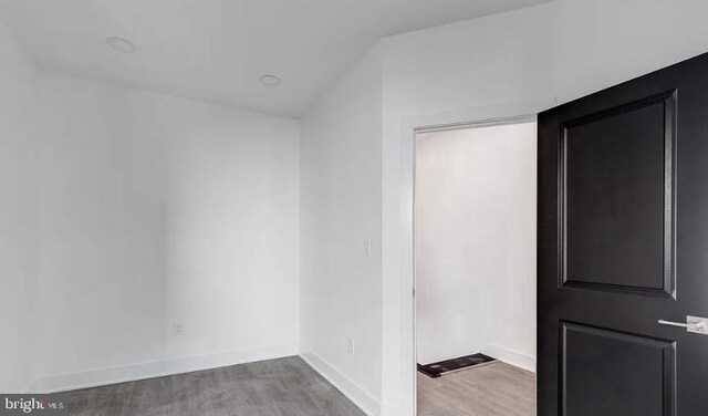 spare room featuring hardwood / wood-style flooring