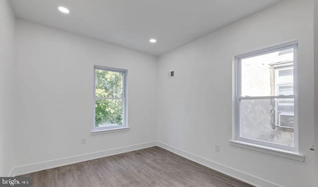 unfurnished room featuring wood-type flooring