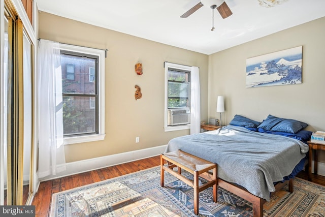 bedroom with ceiling fan and dark wood-type flooring