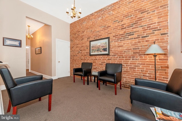 living area with carpet floors, brick wall, and a chandelier