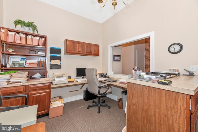 office featuring high vaulted ceiling, dark colored carpet, and a chandelier