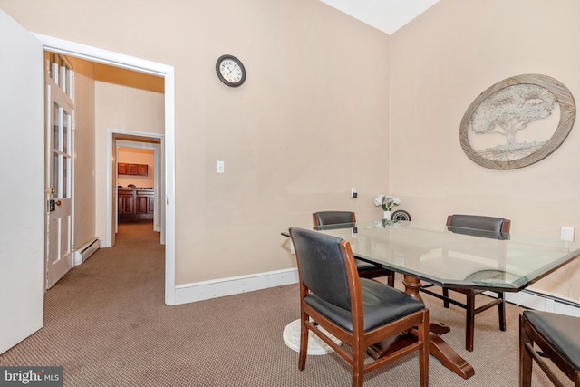 carpeted dining room with a baseboard radiator