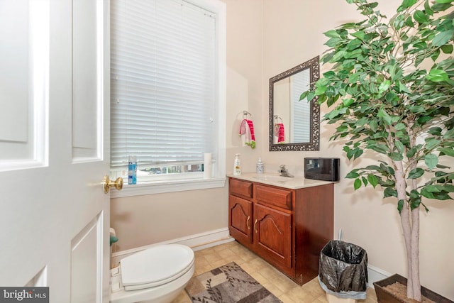 bathroom with tile patterned floors, vanity, and toilet