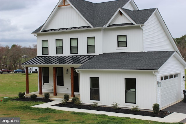 modern farmhouse style home featuring a garage, a front lawn, and covered porch