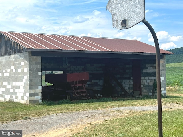 view of property exterior with a yard