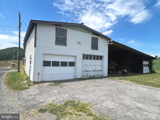 view of property exterior featuring a garage