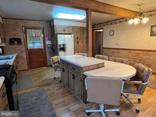 kitchen with black / electric stove, white fridge with ice dispenser, a center island, and light hardwood / wood-style flooring