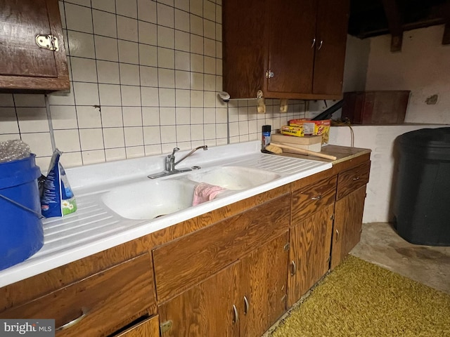 kitchen with sink and tasteful backsplash