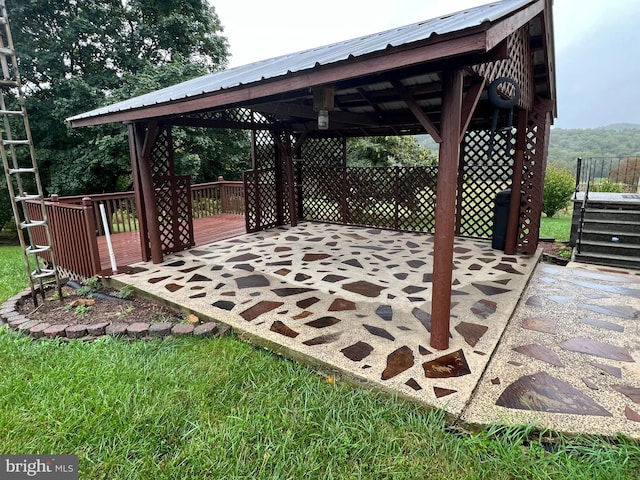 view of patio with a deck and a gazebo